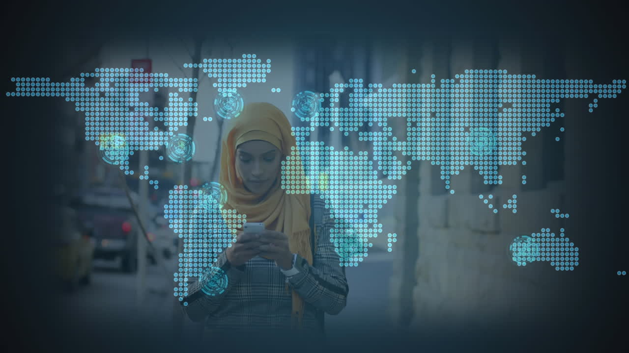 Animasi peta dunia di atas wanita Asia berhijab menggunakan ponsel pintar
