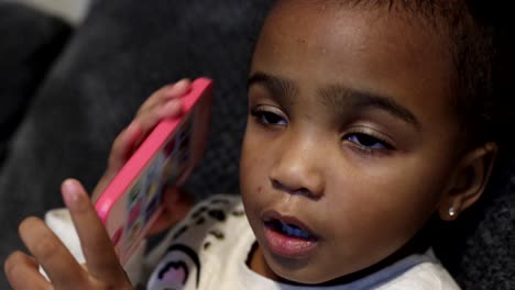 close up of child watching television