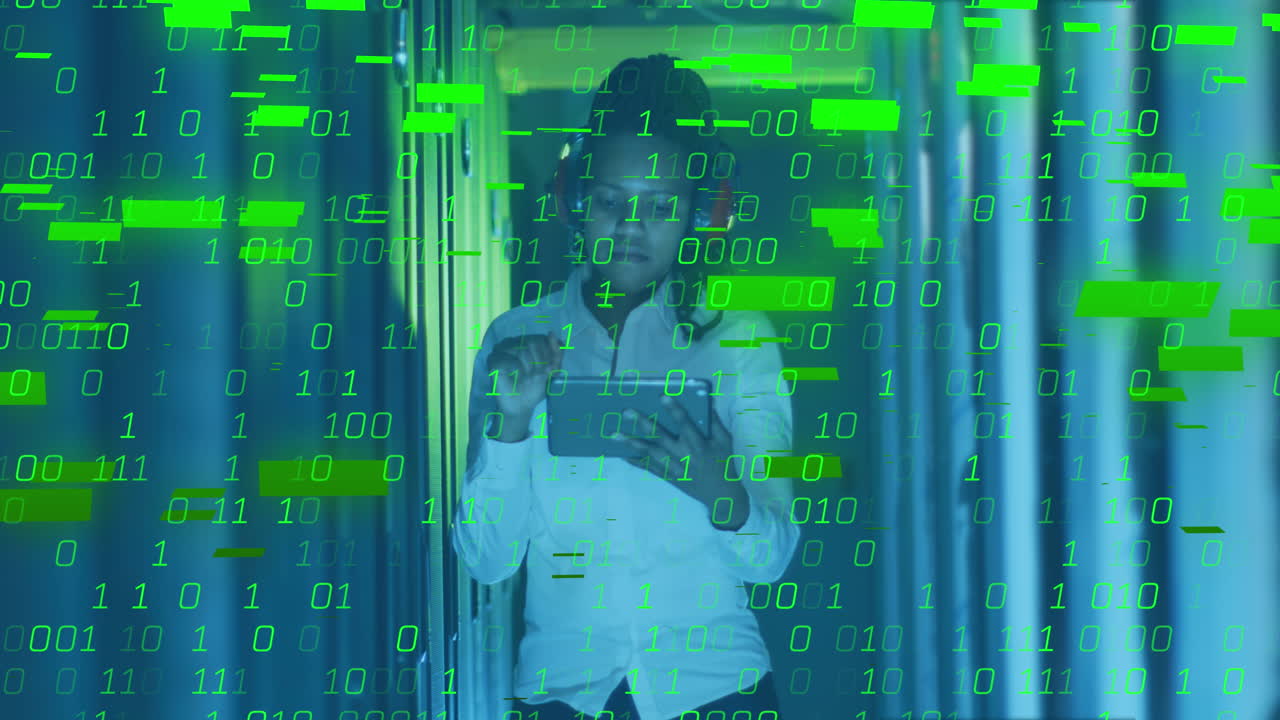 Animation of binary coding against african american female engineer using tablet at server room