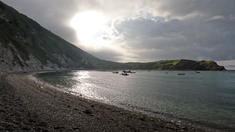 the pebble beach at lulworth cove in dorset, england