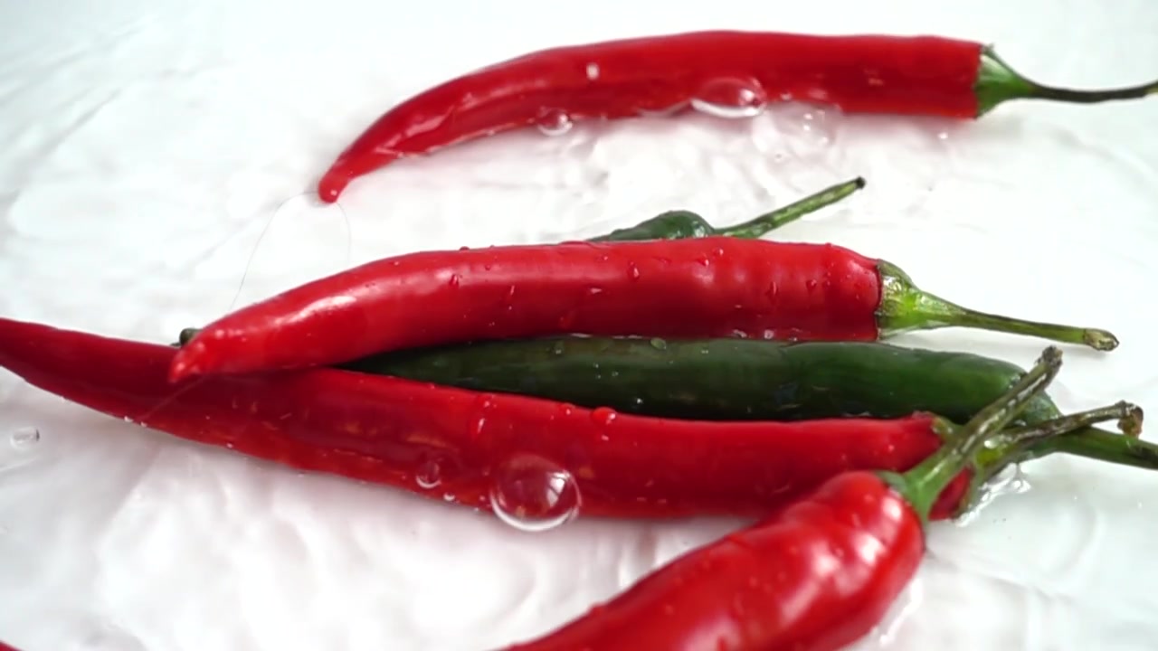 Fresh chili pepper. Slow motion.