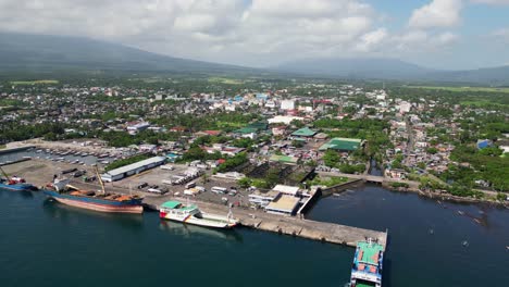 idyllic view of tabaco port with passenger ferries and cargo ships. -aerial drone shot