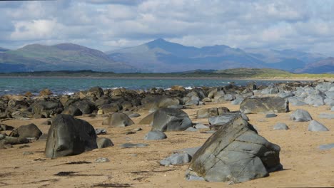 wide shot of rocky coastline no 12 , looking towards the llyn peninsula from near morfa dyffryn, wales, uk, static camera, 10 second version