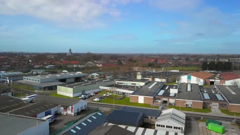 the historical city of middelburg with in the foreground a canal and industrial area