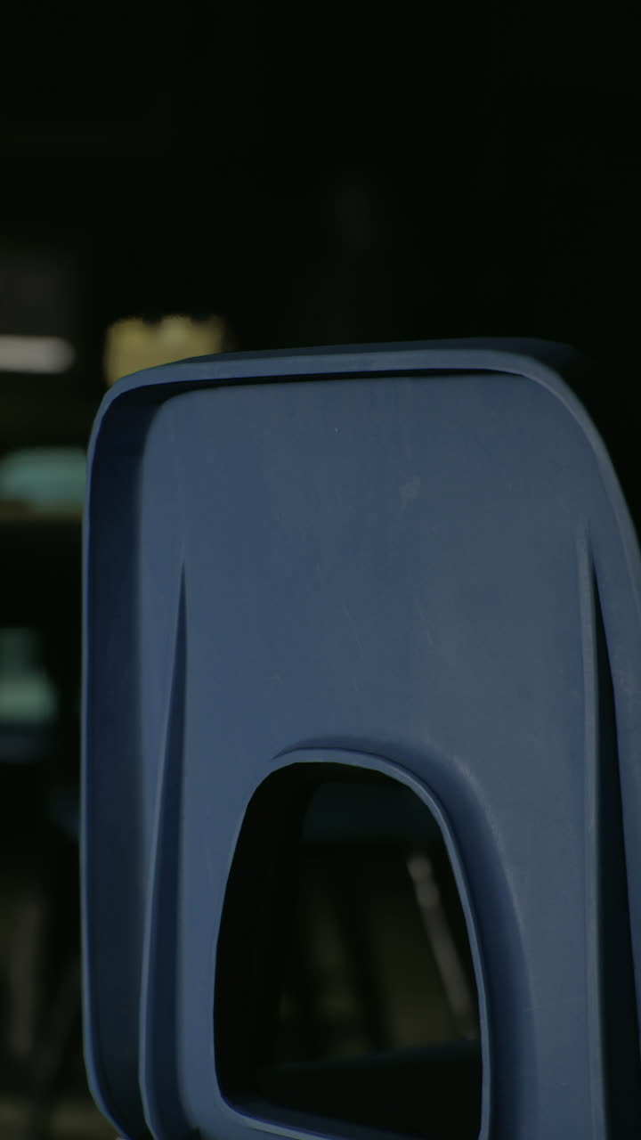 Quiet classroom with empty chairs and dim lighting in an educational setting