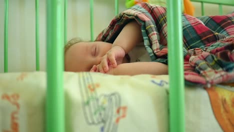 newborn child in crib