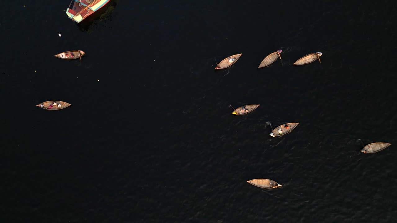 Birds eye view drone shot small fishing boats on Buriganga River