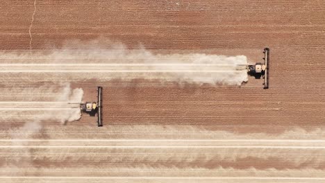 this footage captures the synergy of modern agricultural technology, showcasing the essential role of header fronts in the wheat harvesting process