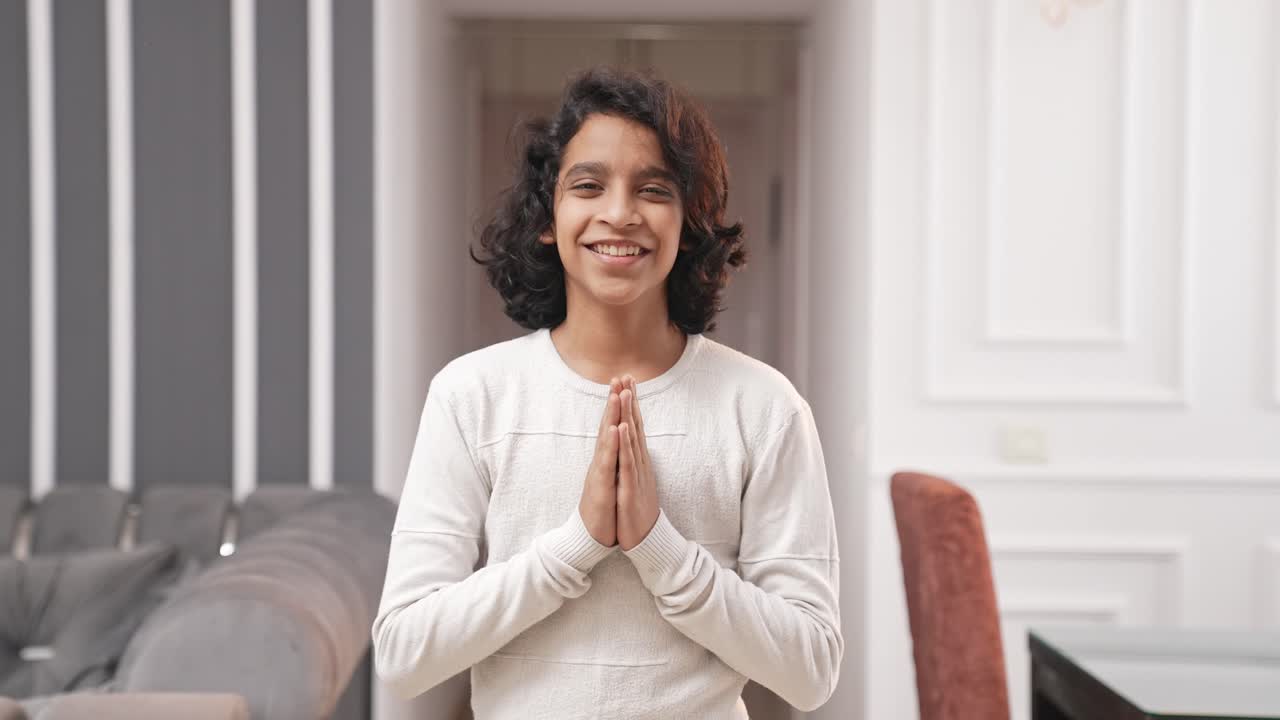 Indian kid boy doing namaste