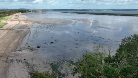 drone static of woodstown beach at low tide on waterford estuary on a sunny autumn day