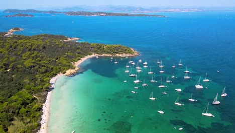 aerial view of beautiful beach with boats and turquoise water