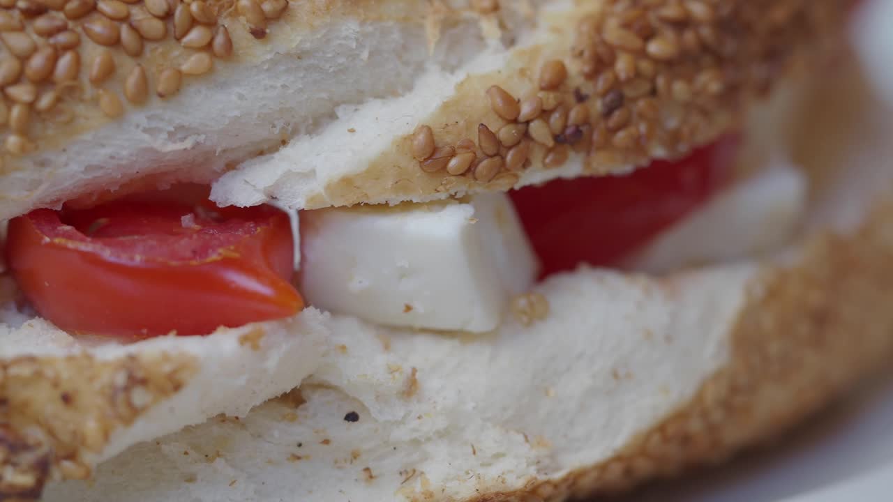 Close-up of a Fresh Sandwich with Tomato and Cheese
