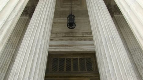 view of columns a hanging lamp and bronze doors at the west entrance of the supreme court