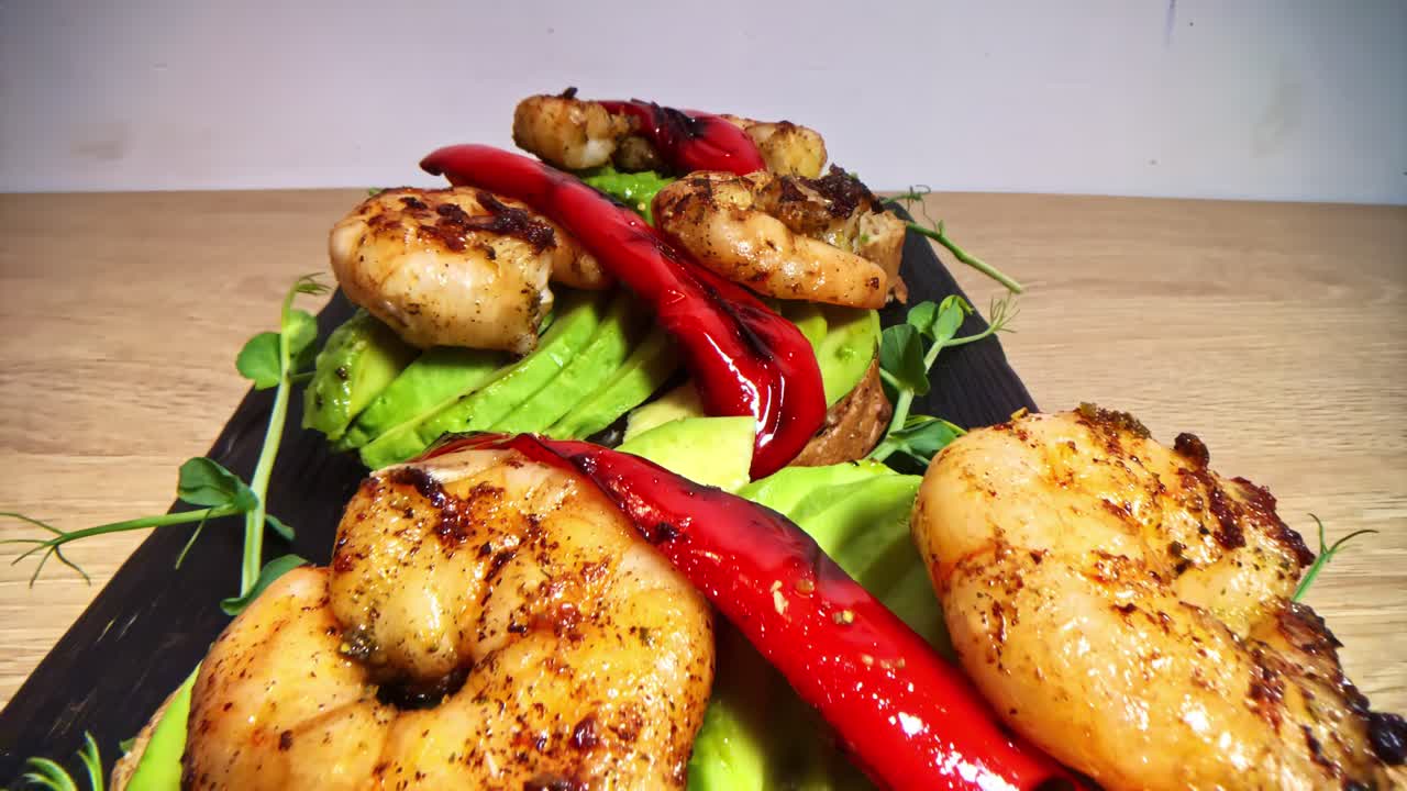 Gourmet avocado toast topped with prawns and roasted peppers open face sandwich