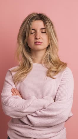 blonde adult woman expressing negativity with head