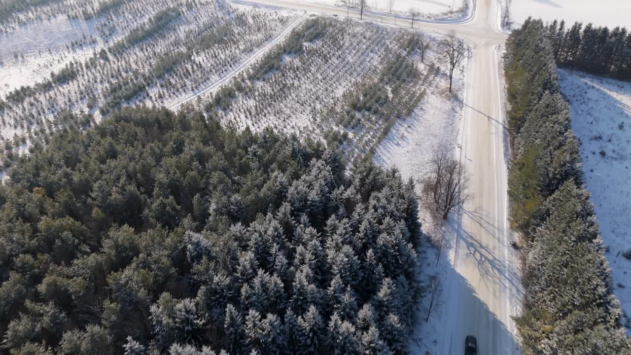 Car Driving On A Snow Covered Road In A Rural Winter Landscape In Caledon, Ontario, Canada.