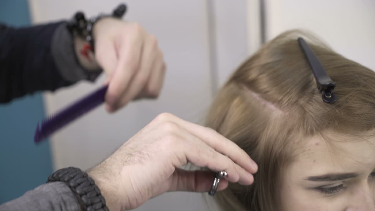 Woman cutting her hair in hairdresser salon