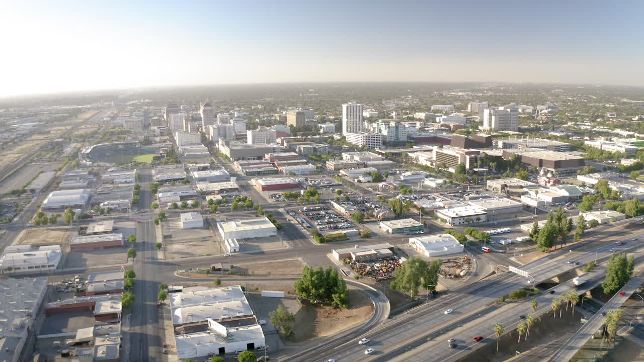 Aerial View of a City with a Major Highway and Buildings