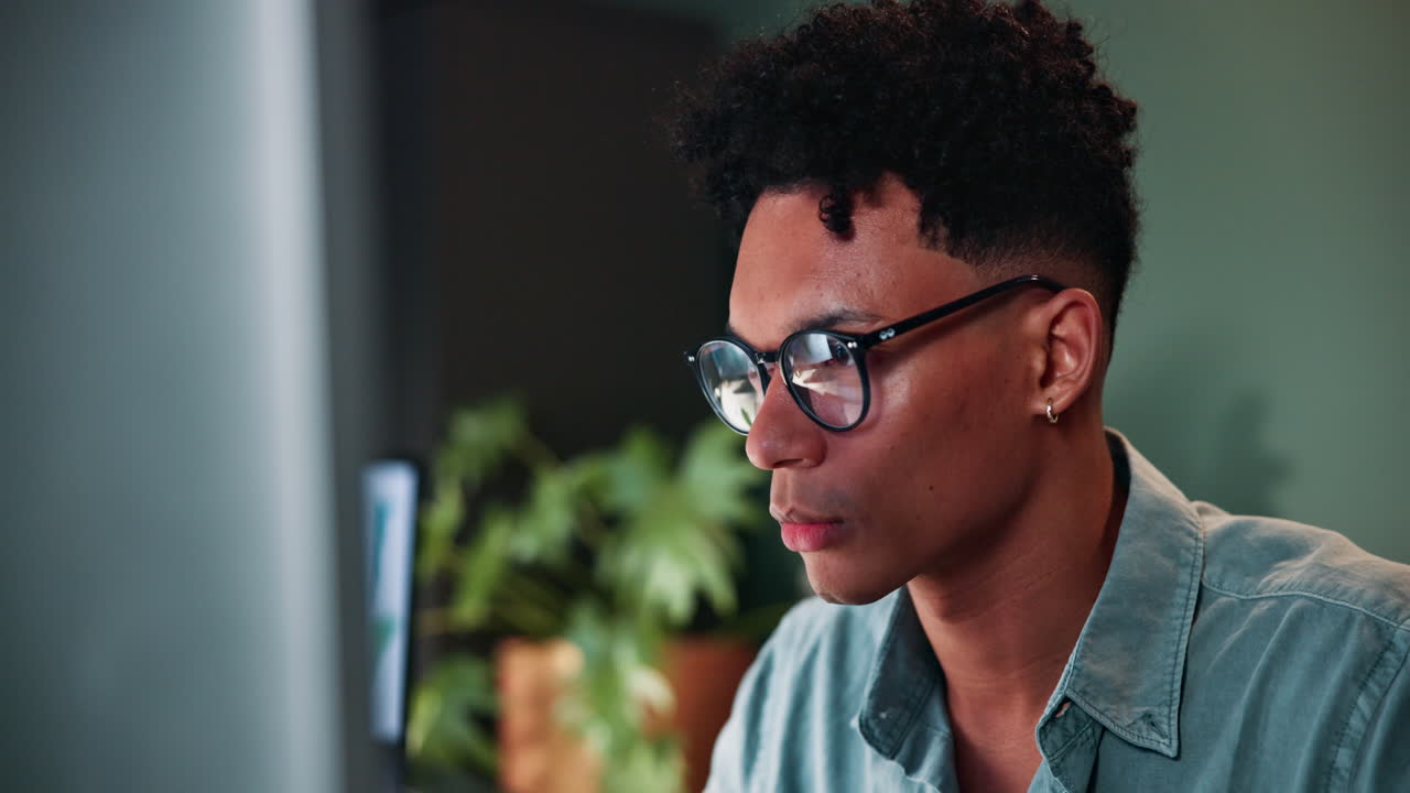 Tired employee working late at night in the office.