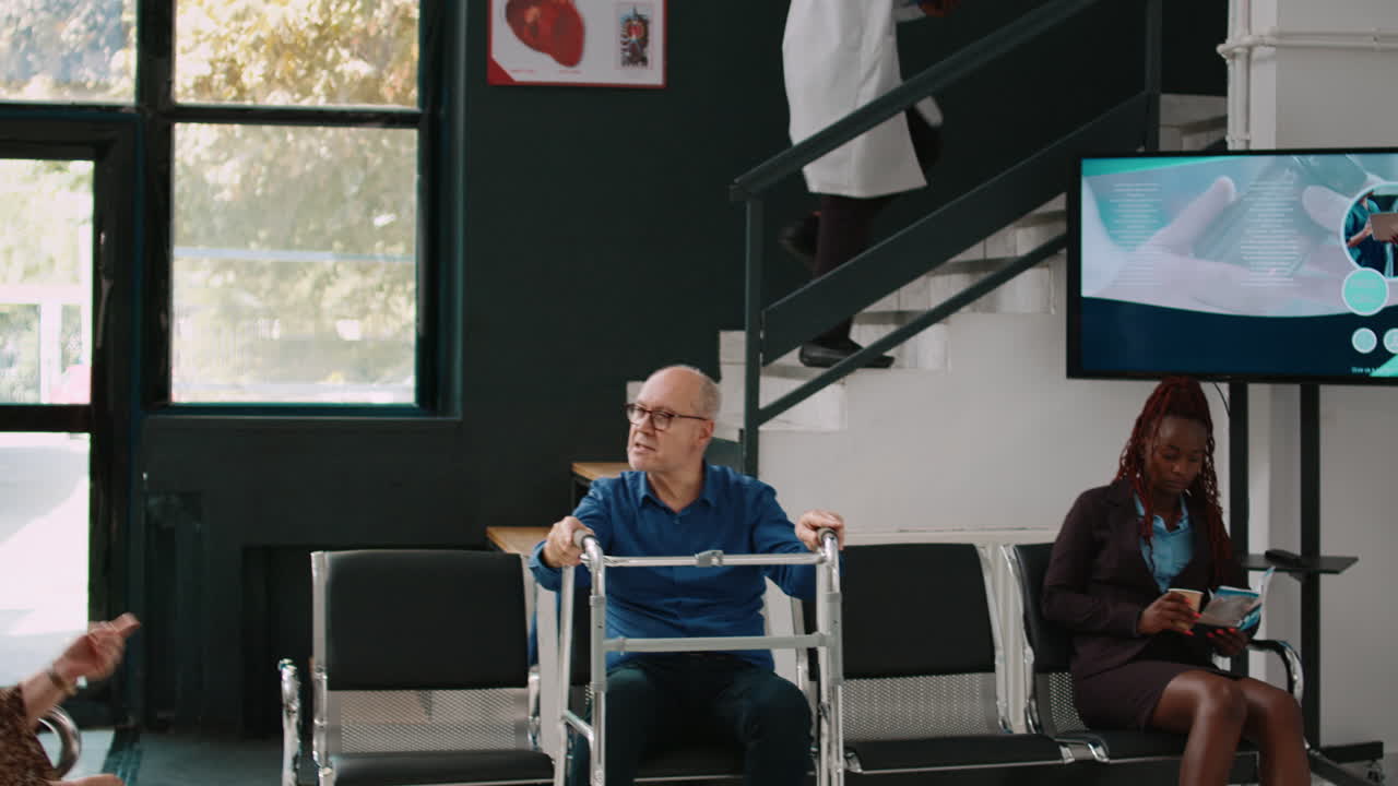 Senior person with walking frame sitting in waiting area