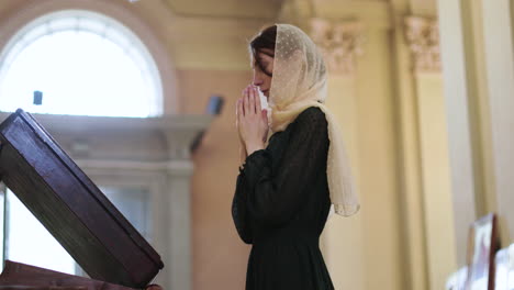 woman praying in the church