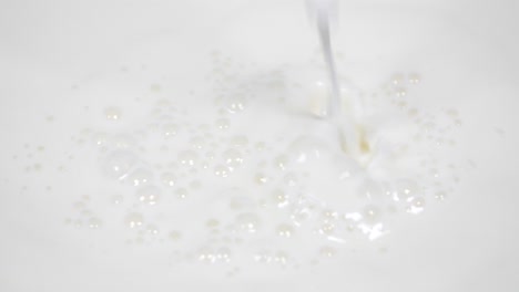 Pouring fresh milk in super slow motion 4k