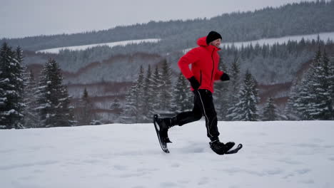 man snowshoeing in winter forest