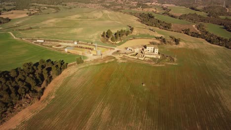 Windmills-and-rural-landscape-in-igualada,-barcelona-at-sunset,-aerial-view