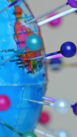 spinning globe earth with pins