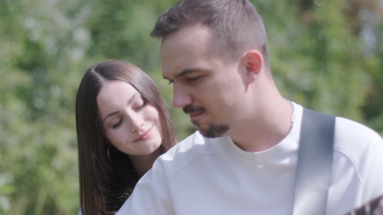 Couple enjoying music outdoors