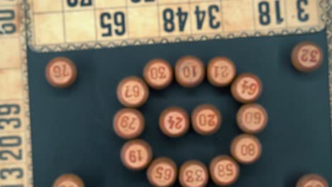 creative close-up smooth zoom in shot from above of a bingo wooden barrels in a circle, woody figures, old numbers background, vintage board game, professional lighting, slow motion 4k video