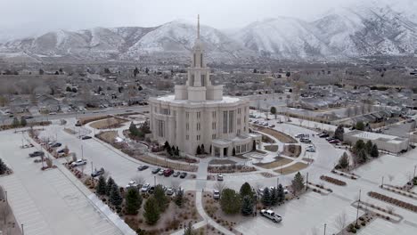 aerial view of payson utah temple with beautiful snowy mountains in background