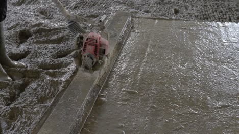 smoothing concrete with a concrete float