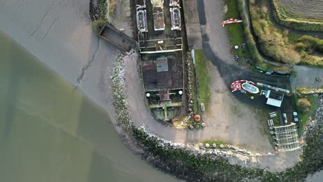 Ghost-Ship-the-Duke-of-Lancaster-at-sunset---drone-gimbal-down-pan-from-above---Mostyn,-Wales,-UK