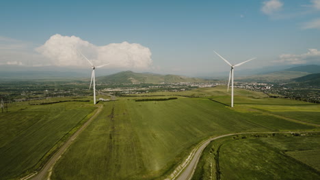 wind turbine generators slowly rotating in rural countryside, georgia