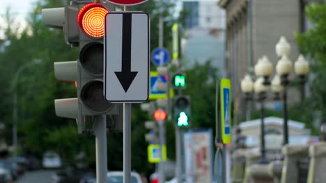 city street intersection with traffic lights and pedestrians