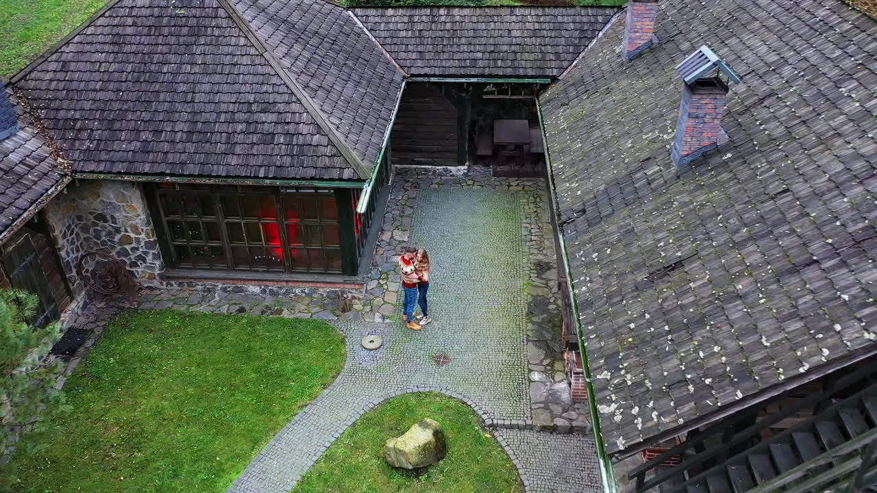 Loving romantic couple in village. Young cheerful couple in romantic autumn landscape