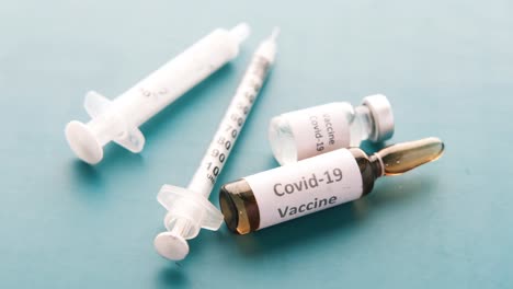 covid-19 vaccine and syringes