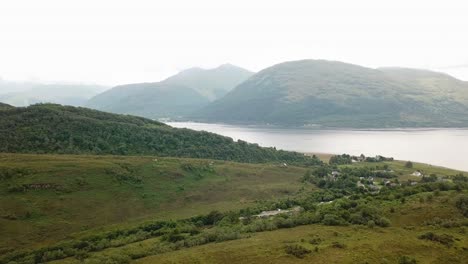 Drone-flying-over-Glencoe-Scottish-mountains,-Scotland