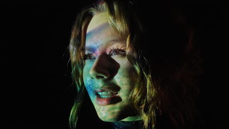 abstract portraits of a woman with colorful light projections