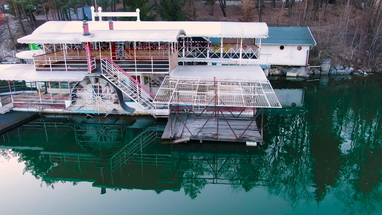 tourist boat cruise along Smartinsko lake. getaway experience. Aerial arc shot