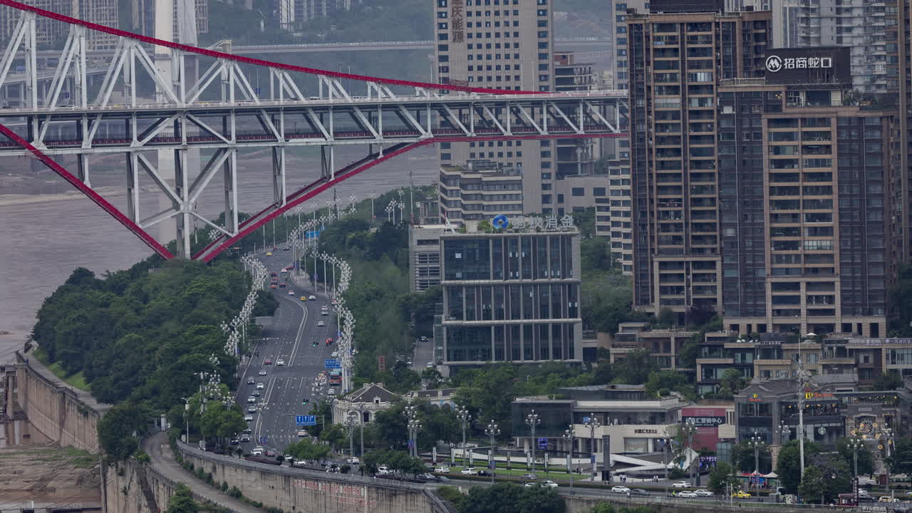 Timelapse of the amazing Chongqing cyberpunk city skyline from a high vantage point wirh the yangtze river at sunset