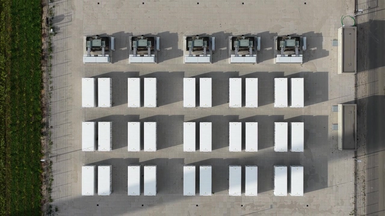 Aerial drone view of Cleve Hill Solar Park near Faversham, Kent, showing large-scale renewable electricity generation, battery storage and modern solar infrastructure.