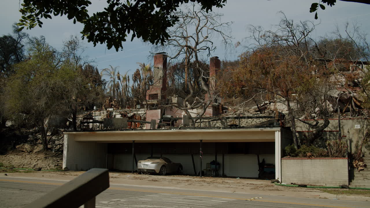 Aftermath of a Fire: Damaged House and Car