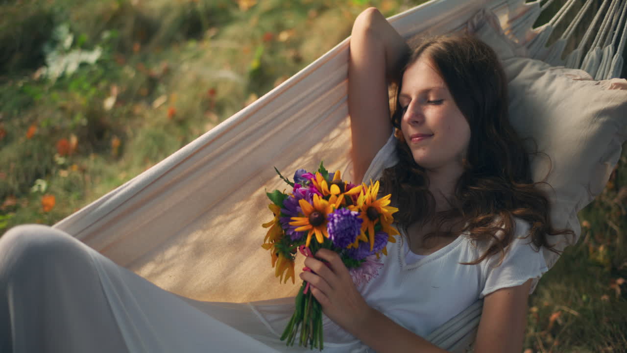 Serene moment of girl swinging at golden hour