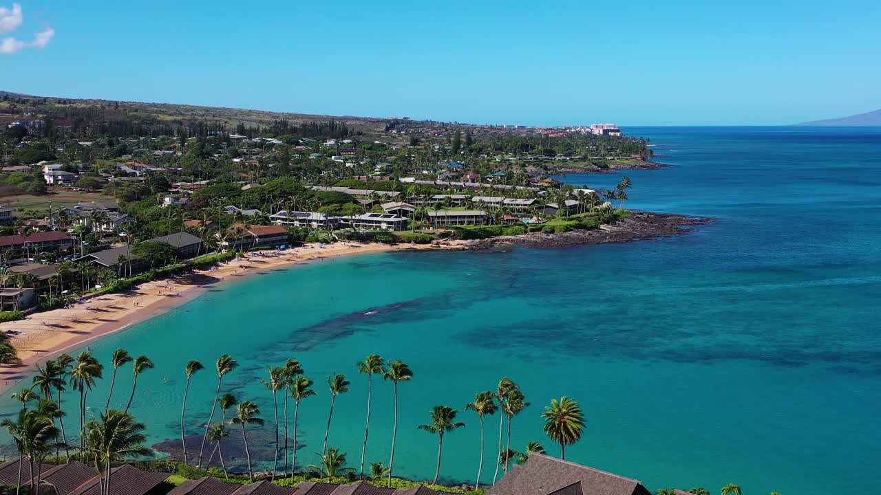 drone shot of west side of maui showing ocean, beaches and various hotels