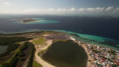 gran roque with lagoon, runway, and village in los roques, venezuela, aerial view