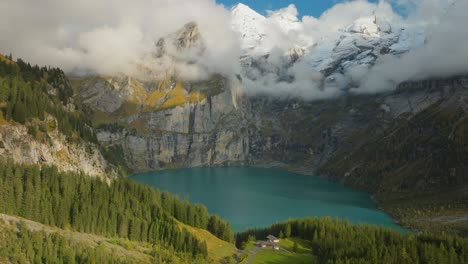 oeschinen lake surrounded by majestic mountains in the alps