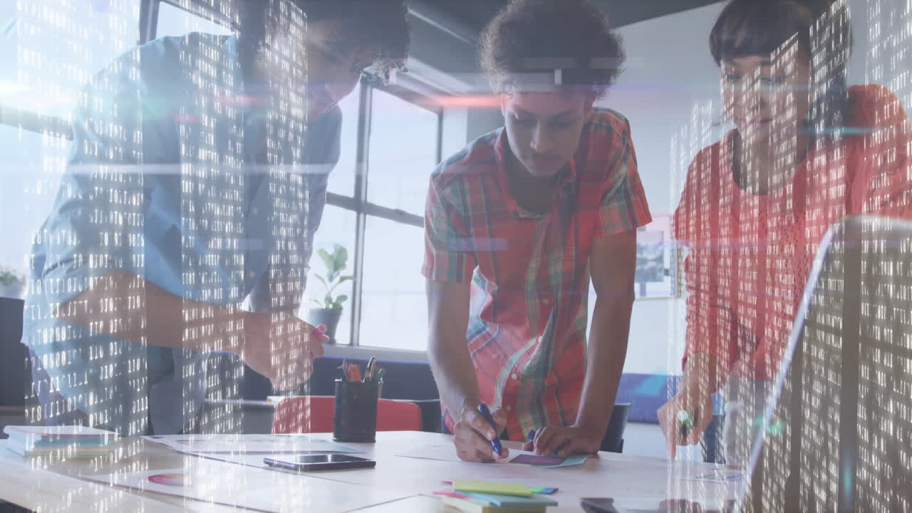 Collaborating at office desk, young professionals using animation with digital data