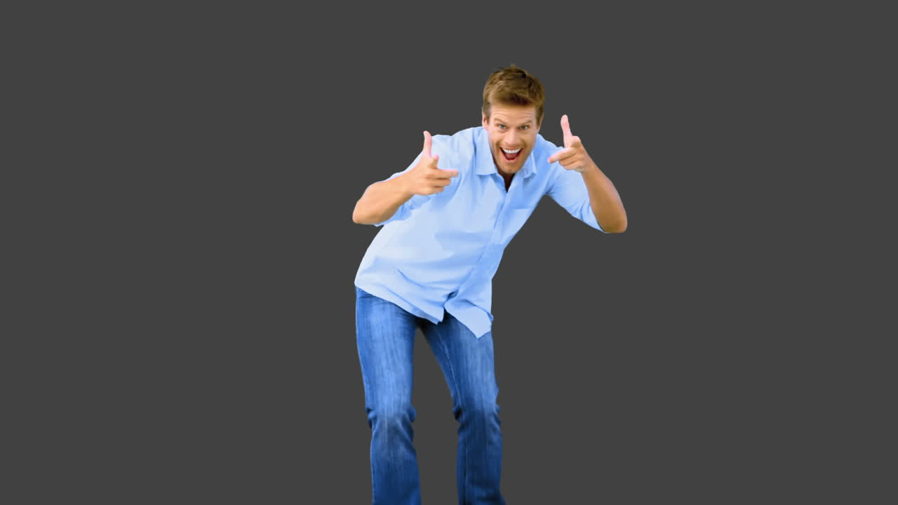 Man skating and pointing at camera on grey screen